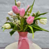 A sweet mix of tulips in a colorful Vase- Please note: 
