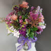 A beautifully selected bunch of the freshest flowers in a vase uniquely