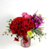 Vibrant red roses, fragrant stock and elegant Dutch callas are accented with