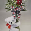 Adorable 5.5" white bear hugs the bud vase that is adorned with