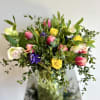 A simple yet elegant flower arrangement of tulips, hyacinths and eucalyptus foliage