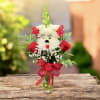 A cute and playful floral &ldquo;pup&rdquo; arrangement designed with white mums to