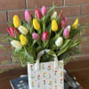 Brighten any space with this cheerful arrangement of 20 fresh spring tulips