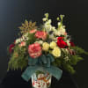 A wintery and adorable arrangement with a little snowflake and cardinal, .spray