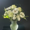 Elevate any space with this timeless all-white flower arrangement, designed in the