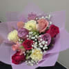 Bouquet of 12 roses, predominantly pink in different shades, subject to availability
