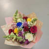 Bouquet of mixed roses subject to store availability, with decoration.