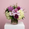 Soft lavender blooms arrangement featuring roses, hydrangea, cremones, carnations in a 5''
