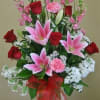 Greenery,red roses pink lilies, carnationsnapdragons.
