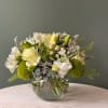 A soft, all in white and green floral design for moments that