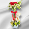 Cube vase with alstroemerias, roses, filler, greenery and a little bear.
 If