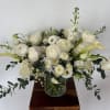 A mix of designer&rsquo;s choice white blooms to include premium stems of