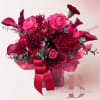 A luxurious Valentine&rsquo;s Day floral arrangement featuring rich berry tones of crimson