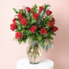 
A classic Valentine&rsquo;s Day arrangement featuring two dozen premium roses paired with