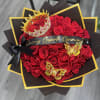 A bold and luxurious bouquet featuring 50 red roses, beautifully wrapped in