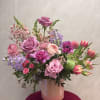 A beautiful seasonal mix including roses and stock. Created in an iridescent