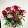 A luxurious arrangement of 24 premium red and purple roses artfully designed