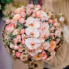 This exquisite bouquet is a true celebration of soft, harmonious hues and