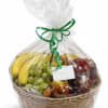 A fruit basket with snacks in a basket 