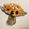 A beautiful bouquet made of yellow roses and stunning sunflowers perfectly put