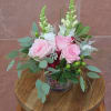 A low-profile arrangement featuring roses.