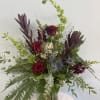 This moody, woodsy arrangement is perfect for any occasion! This arrangement exudes