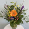 This colorful arrangement is the perfect gift for any occasion. Inspired by