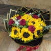 sunflowers, red roses, babys breath and eucaliptos.