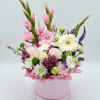 A bright and lively floral composition with elegant gladiolus taking center stage.