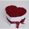 This white heart box includes 24 red roses 