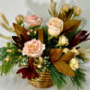 Soothing dried elements accent these peach, brown, and burgundy blooms giving this