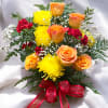 This vibrant floral arrangement features a harmonious blend of colors and textures