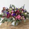 This arrangement is present in a 6"*6" white cylinder vase. The arrangement