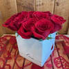 A dozen red roses in a ceramic cube sending your love and
