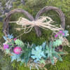 12'" wreath with succulents and other accents .  Available for delivery