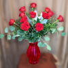 Our Signature Dozen Elegant Red Roses in a festive Red vase for