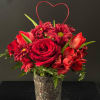 This arrangement is full of beautiful red blooms like, red roses, red