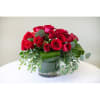 A mix of our finest roses in a low and lush vase.