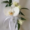 Phalaenopsis orchid with spray roses