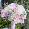 Beautiful round bouquet  with hydrangeas,  roses, wax, brunia and carnations