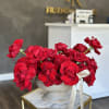 A beautiful rose arrangement in a vase will make an excellent present