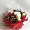This cute basket bouquet wrapped in red cello is a perfect to