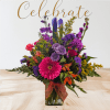 This is a bright colorful bouquet with a mix of long-lasting flowers.