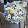 A gorgeous bouquet of blue and white flowers can give any event