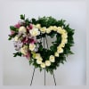 Funeral wreath made with white carnations, a symbol of purity and peace