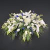 A lovely mixture of white flowers such as roses, lilies, hydrangeas, lisianthus
