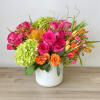 A bold mix of hot pinks, oranges, and green florals ready to