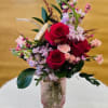 Pink roses, lavender stock pink spray roses accented with greens and pretty