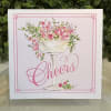 Cheers enclosure card featuring a pink flowers. A special touch to add