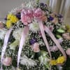 A beautiful mix of pink/white roses, yellow/whit carnations, purple delphinium, baby's breath
